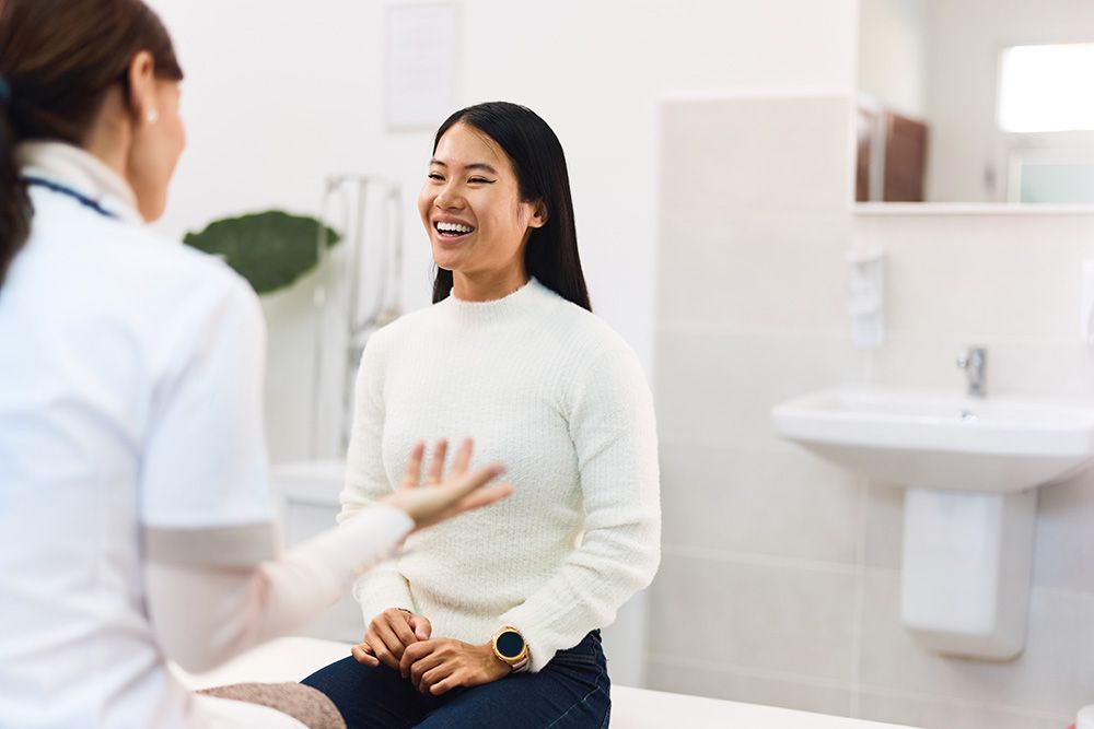 woman taking to her doctor during her Annual Gynecology Exam