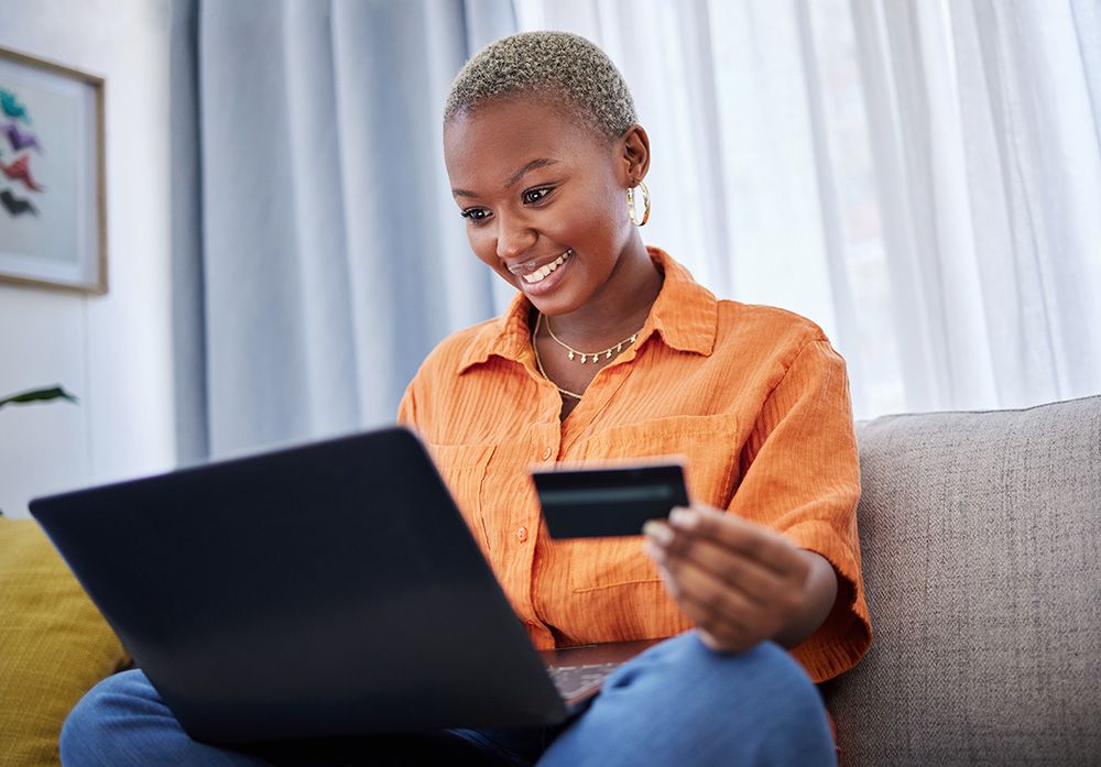 woman paying her bill on a laptop computer